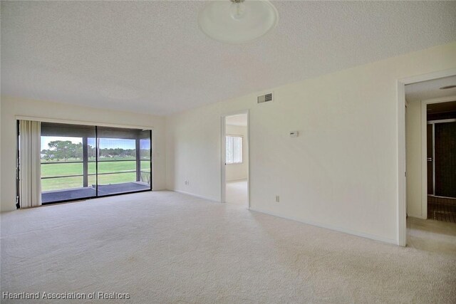 5544 Matanzas Dr, Sebring, FL 33872 - carpeted empty room with a textured ceiling and baseboards