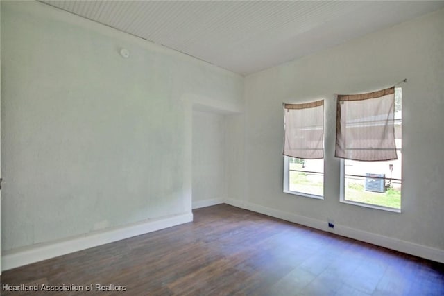 empty room featuring dark wood-type flooring