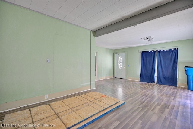 unfurnished room featuring hardwood / wood-style flooring