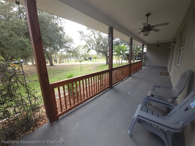 view of patio featuring ceiling fan