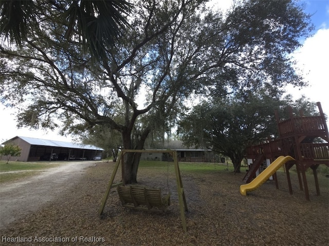 community playground with an outbuilding