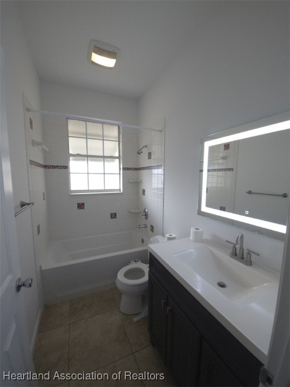 full bath featuring tile patterned flooring, bathtub / shower combination, vanity, and toilet