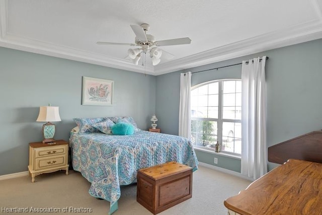 bedroom with ornamental molding, light colored carpet, and ceiling fan