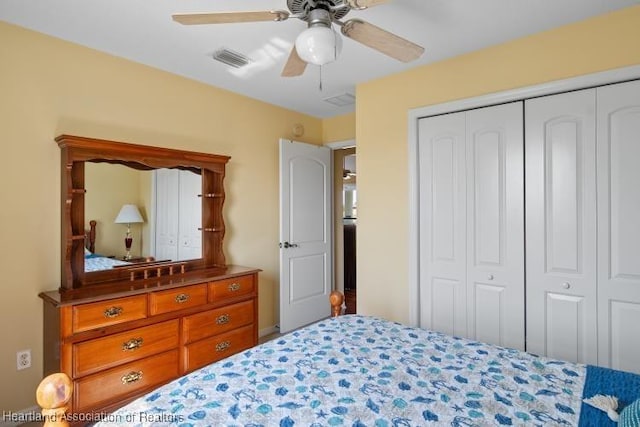 bedroom with ceiling fan and a closet