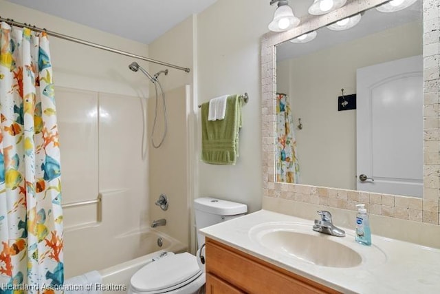 full bathroom with vanity, toilet, and shower / bath combo with shower curtain