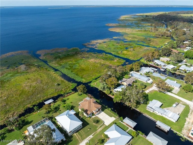 112 Wild Duck Pt, Lorida, FL 33857 - aerial view of property and surrounding area featuring a large body of water and nearby suburban area