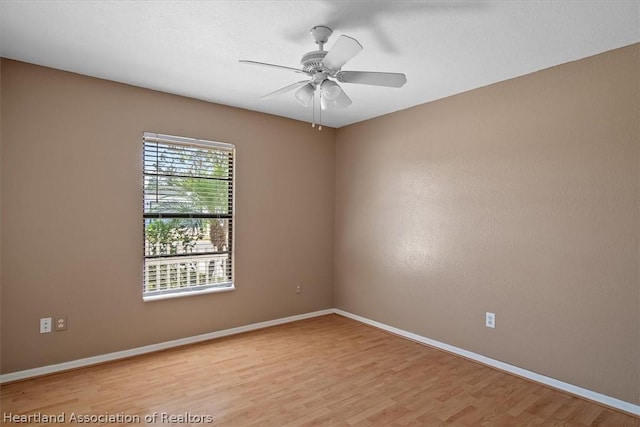 spare room with ceiling fan and light hardwood / wood-style floors