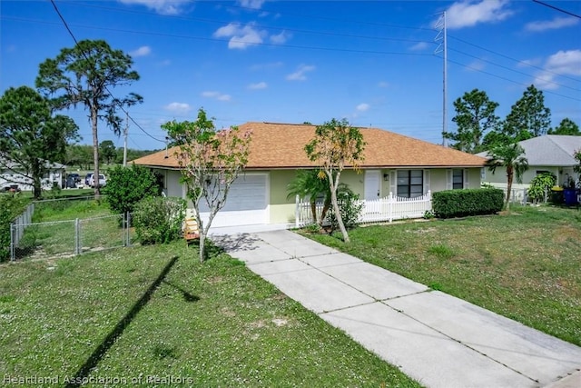 ranch-style house with a garage and a front yard