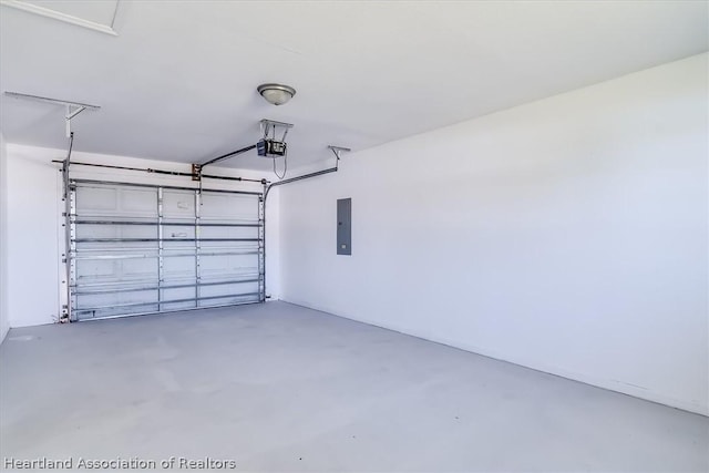 garage featuring electric panel and a garage door opener