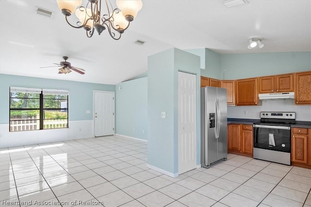 kitchen featuring ceiling fan with notable chandelier, light tile patterned flooring, stainless steel appliances, and decorative light fixtures