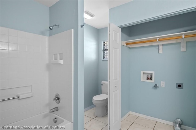 bathroom featuring tile patterned floors, shower / washtub combination, and toilet