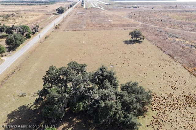 birds eye view of property with a rural view