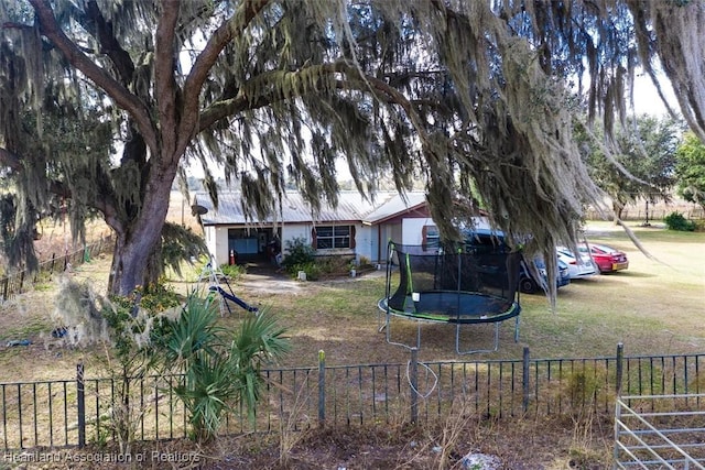 view of yard with a trampoline