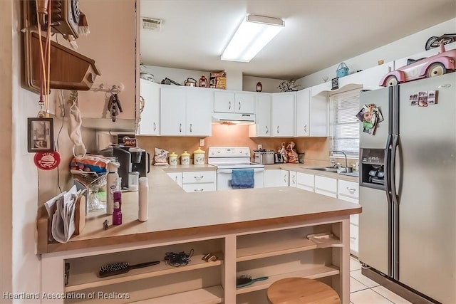 kitchen with white cabinetry, stainless steel fridge with ice dispenser, white electric stove, and sink