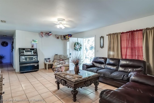 tiled living room featuring ceiling fan