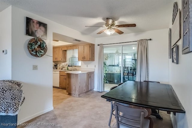 kitchen with ceiling fan, dishwasher, and a textured ceiling