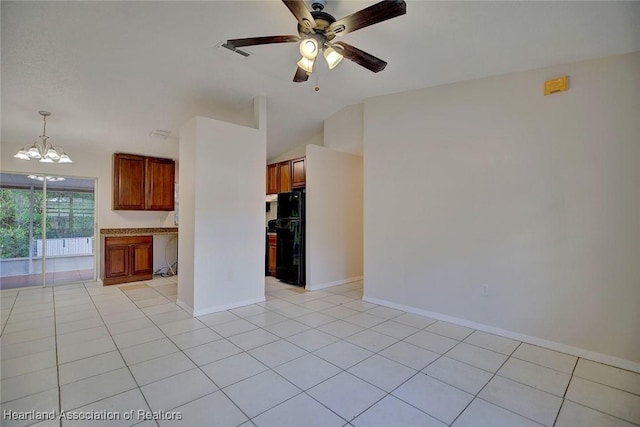 unfurnished living room featuring lofted ceiling, light tile patterned flooring, and ceiling fan with notable chandelier