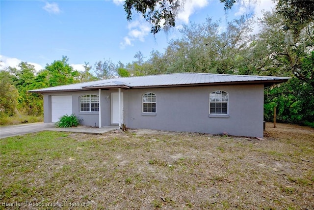 ranch-style home with a garage