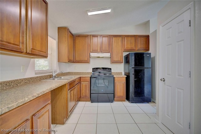 kitchen featuring sink, light tile patterned floors, black appliances, and vaulted ceiling