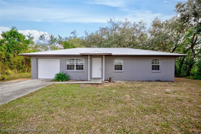 ranch-style home with a garage and a front lawn