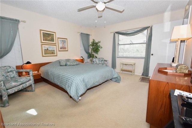 4310 Duffer Loop, Sebring, FL 33872 - bedroom with a textured ceiling, carpet flooring, and ceiling fan