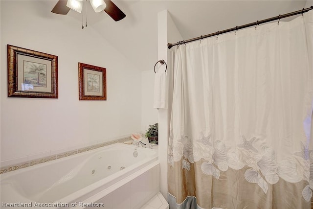 bathroom featuring a relaxing tiled tub, vaulted ceiling, and ceiling fan