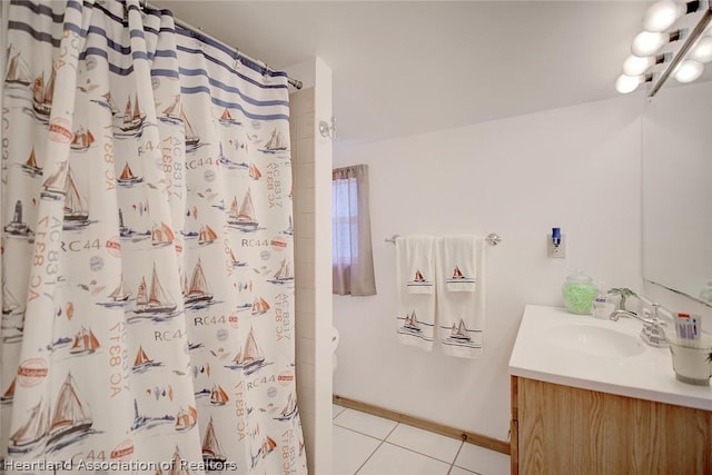 bathroom featuring tile patterned flooring, vanity, and a shower with curtain