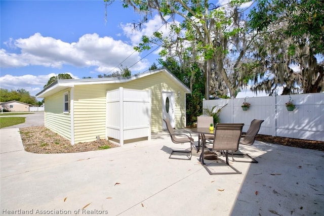 view of patio / terrace featuring a shed