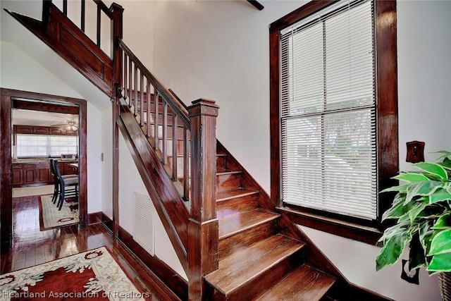 staircase featuring hardwood / wood-style floors