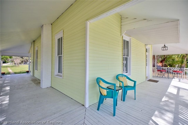 wooden deck featuring covered porch