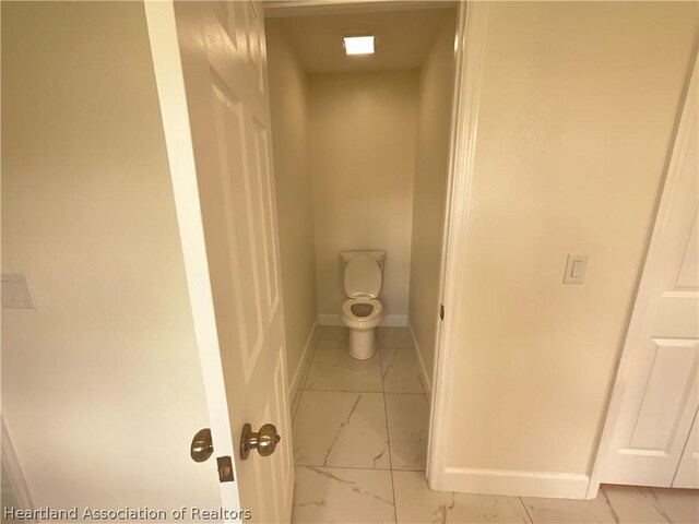 bathroom featuring toilet