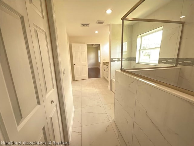 bathroom with vanity and an enclosed shower