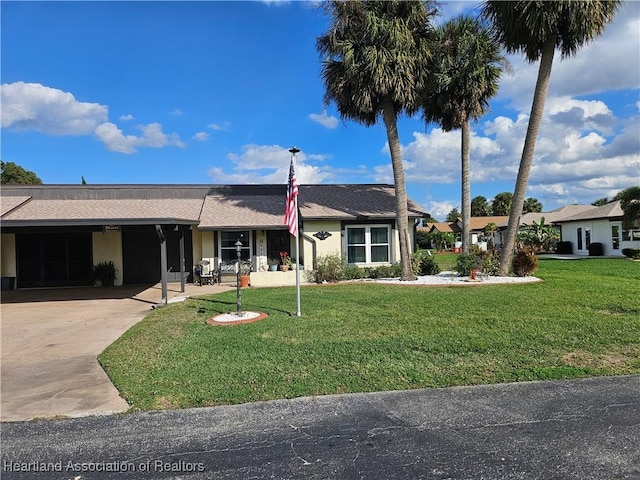 ranch-style house with a front lawn and a carport