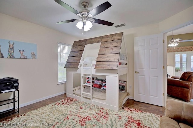 bedroom featuring wood-type flooring and ceiling fan