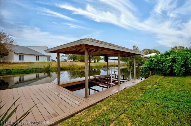 view of dock featuring a water view and a lawn