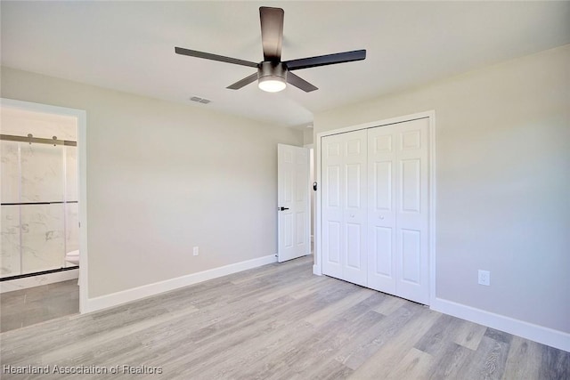 unfurnished bedroom with ceiling fan, a closet, and light hardwood / wood-style floors