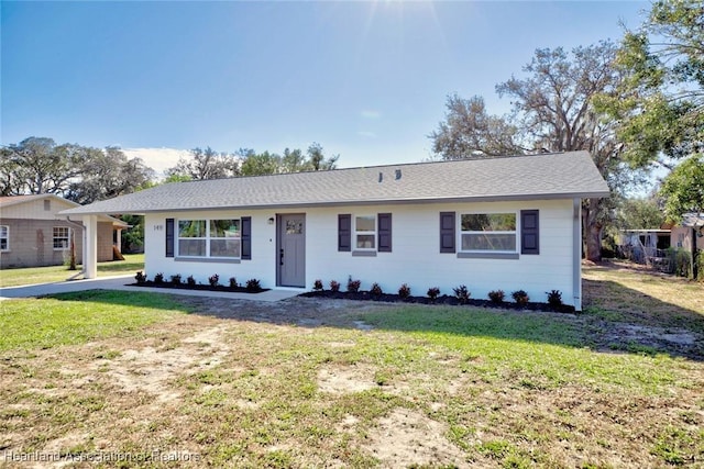 ranch-style home with a front yard