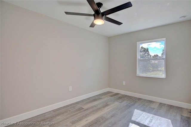 spare room with light hardwood / wood-style floors and ceiling fan