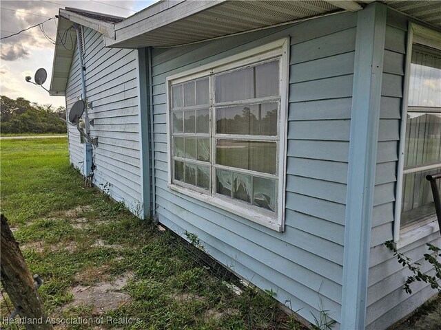 view of property exterior featuring a yard