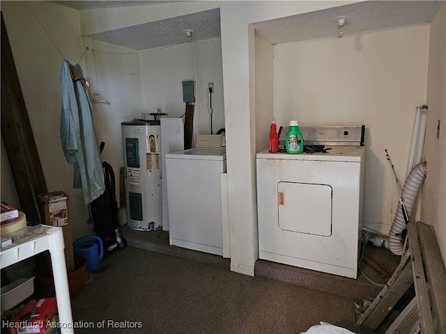 laundry room featuring electric water heater and separate washer and dryer