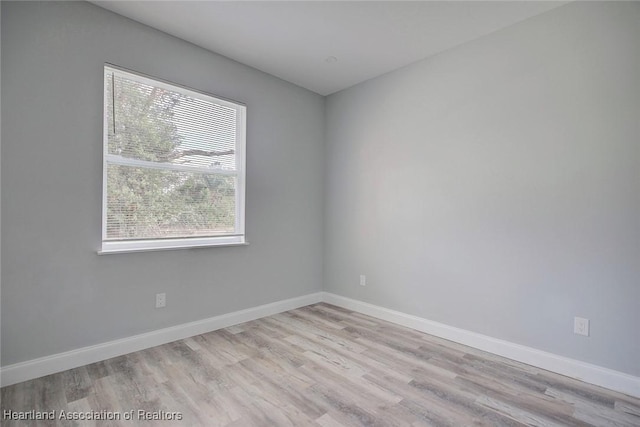 unfurnished room featuring light wood-type flooring