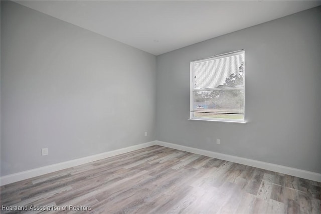 spare room with light wood-type flooring