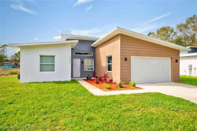 view of front of house featuring a garage and a front lawn