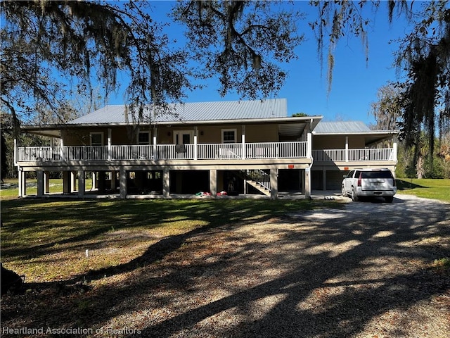 rear view of house with a yard