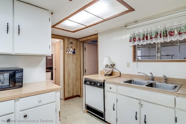 kitchen featuring white cabinetry, sink, and stove