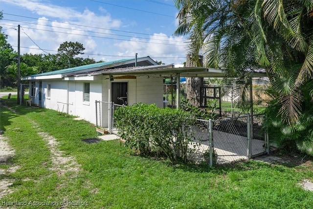 back of property with a lawn