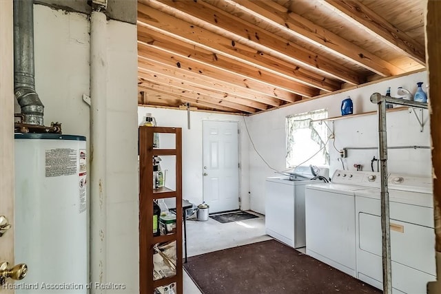 clothes washing area with water heater and washing machine and clothes dryer