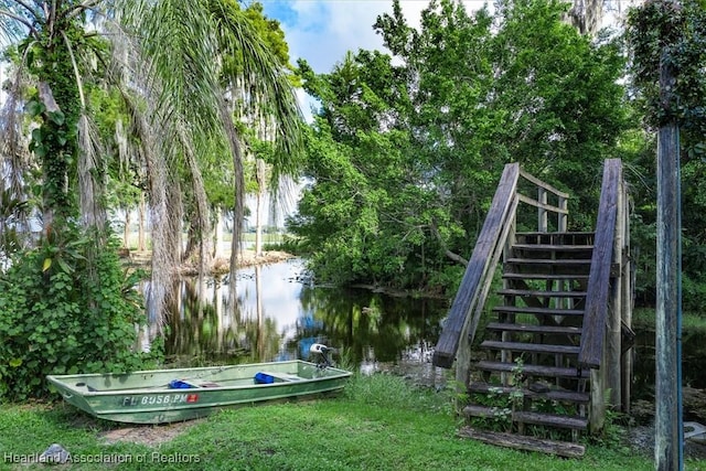 dock area with a water view