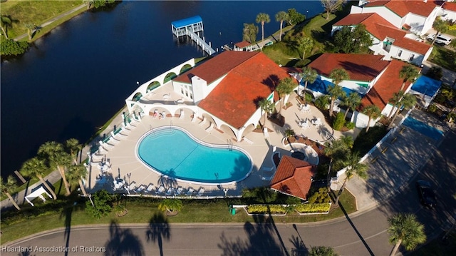 birds eye view of property with a water view