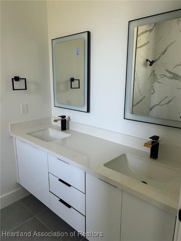 bathroom with tile patterned flooring and vanity